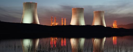 KPMG IFRS 15 (new revenue standard) for power and utilities image: A thermal power station next to a body of water. 